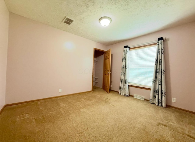13944 Lafayette Rd, Utica, OH 43080 - carpeted spare room with baseboards and a textured ceiling