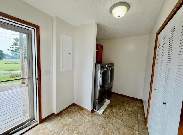 13944 Lafayette Rd, Utica, OH 43080 - laundry room with cabinet space, washer and dryer, electric panel, and a textured ceiling