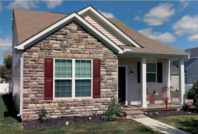 5804 Trail Creek Dr, Dublin, OH 43016 - view of front of home with stone siding and covered porch