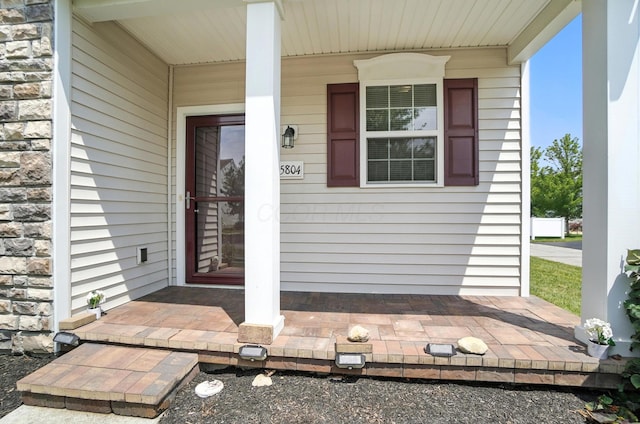 5804 Trail Creek Dr, Dublin, OH 43016 - property entrance with covered porch and stone siding