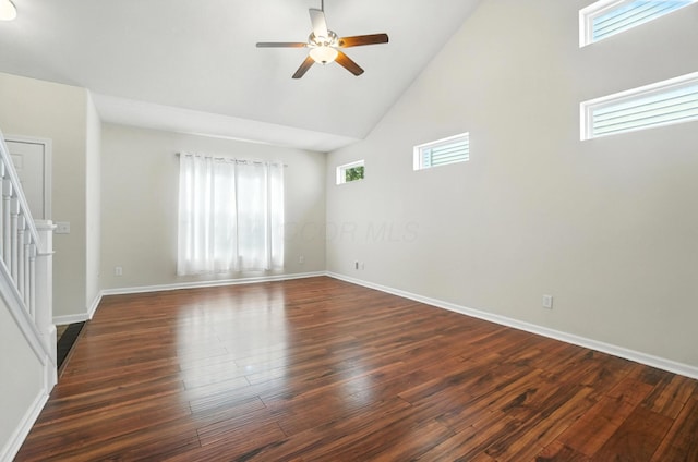 5804 Trail Creek Dr, Dublin, OH 43016 - empty room with ceiling fan, high vaulted ceiling, dark wood finished floors, and stairs