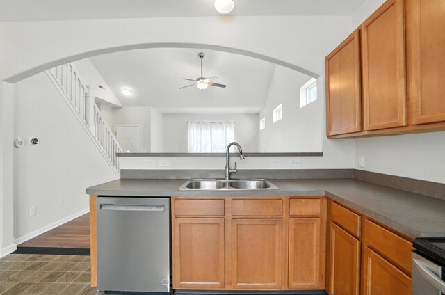 5804 Trail Creek Dr, Dublin, OH 43016 - kitchen with dishwasher, a peninsula, arched walkways, ceiling fan, and lofted ceiling