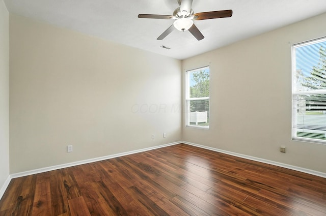 5804 Trail Creek Dr, Dublin, OH 43016 - spare room featuring dark wood-type flooring, plenty of natural light, and a ceiling fan