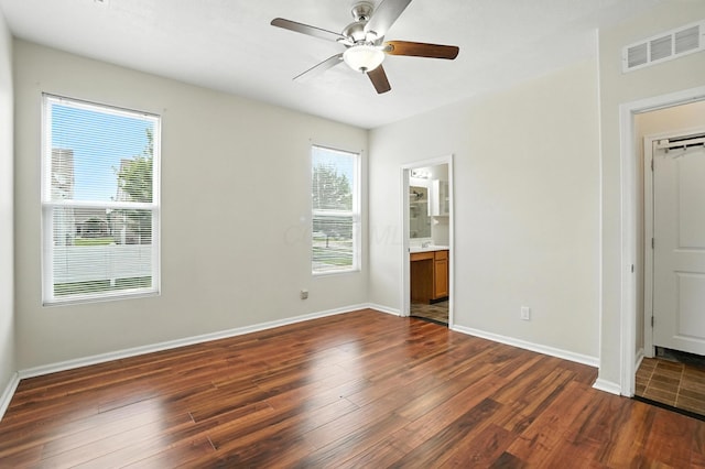 5804 Trail Creek Dr, Dublin, OH 43016 - unfurnished bedroom featuring dark wood-style floors, ceiling fan, and ensuite bathroom
