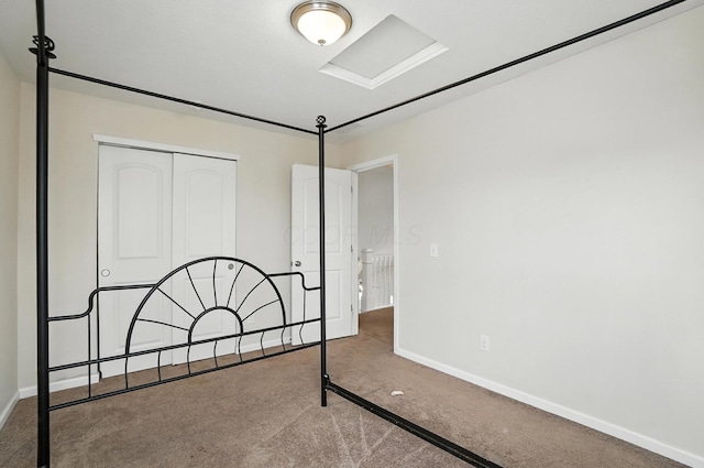 5804 Trail Creek Dr, Dublin, OH 43016 - unfurnished bedroom featuring carpet flooring, a closet, and attic access