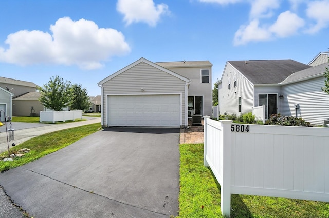 5804 Trail Creek Dr, Dublin, OH 43016 - view of front of property with asphalt driveway and an attached garage