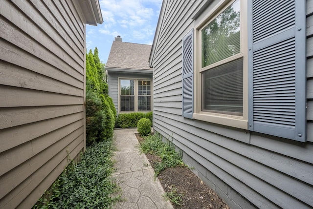 1280 Gemstone Sq W, Westerville, OH 43081 - view of side of property featuring a chimney and a shingled roof