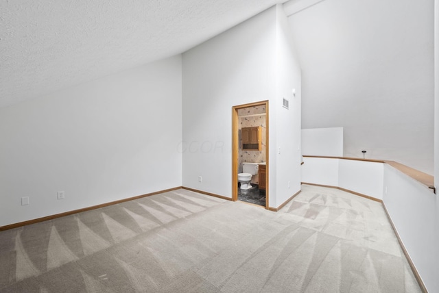 1280 Gemstone Sq W, Westerville, OH 43081 - unfurnished room featuring light colored carpet, a textured ceiling, and high vaulted ceiling