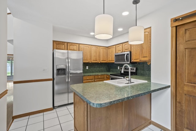 1280 Gemstone Sq W, Westerville, OH 43081 - kitchen with stainless steel appliances, a peninsula, decorative backsplash, dark countertops, and light tile patterned floors