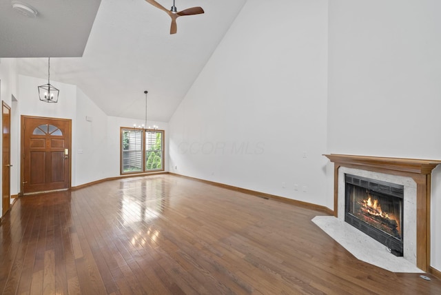 1280 Gemstone Sq W, Westerville, OH 43081 - unfurnished living room with a chandelier, a premium fireplace, hardwood / wood-style flooring, ceiling fan, and high vaulted ceiling