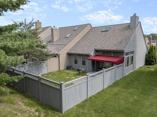 1280 Gemstone Sq W, Westerville, OH 43081 - rear view of house featuring a shingled roof, a chimney, and a fenced backyard