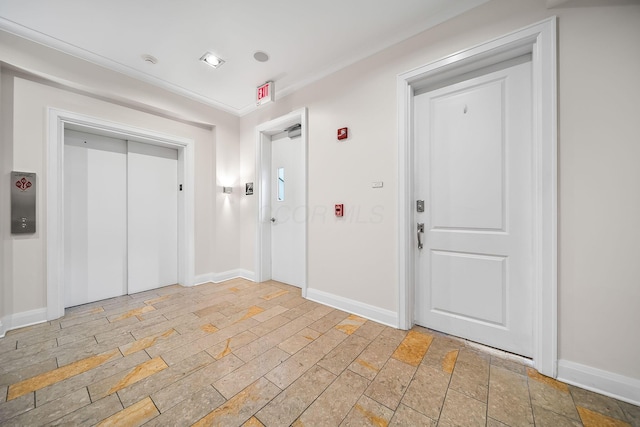 1475 W 3rd Ave Unit 401, Columbus, OH 43212 - foyer entrance featuring elevator, light stone finish floors, and ornamental molding
