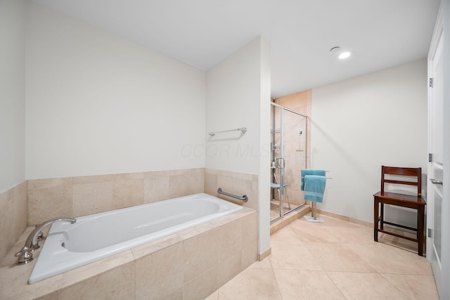 1475 W 3rd Ave Unit 401, Columbus, OH 43212 - full bathroom featuring a garden tub, a shower stall, and tile patterned floors