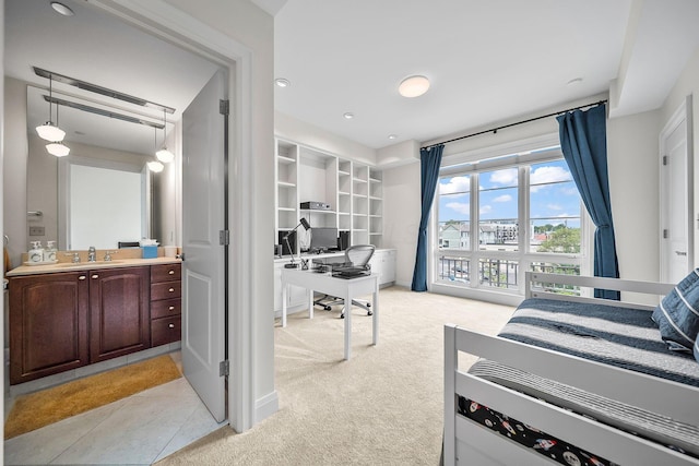 1475 W 3rd Ave Unit 401, Columbus, OH 43212 - bedroom with light carpet and a desk
