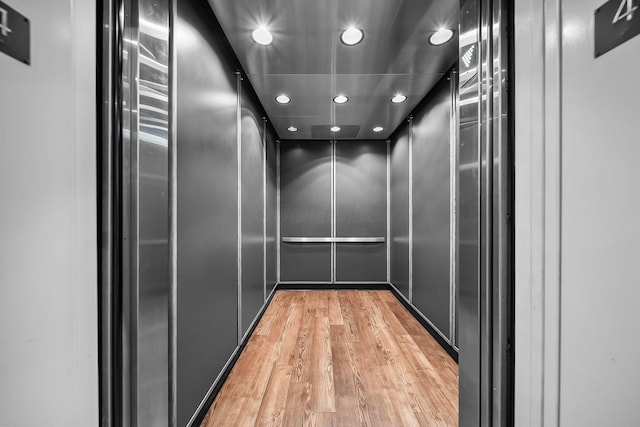 1475 W 3rd Ave Unit 401, Columbus, OH 43212 - elevator with wood finished floors and recessed lighting