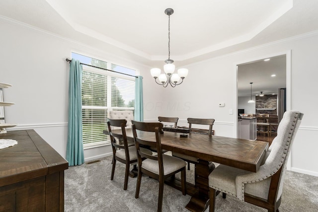 3012 Coltsbridge Dr, Lewis Center, OH 43035 - dining space with a raised ceiling, carpet, a chandelier, and ornamental molding