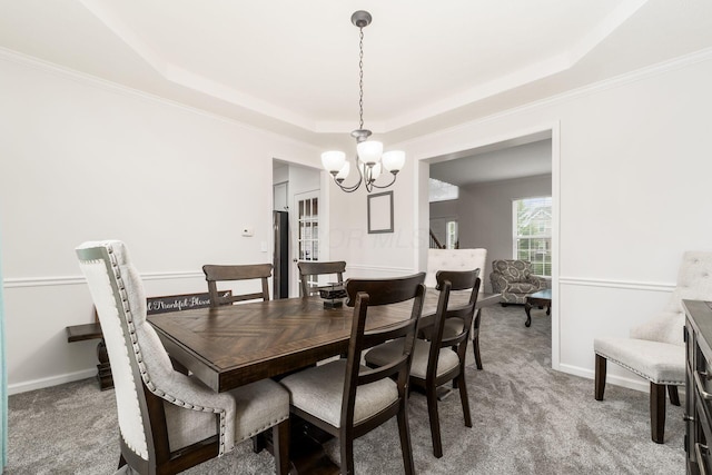 3012 Coltsbridge Dr, Lewis Center, OH 43035 - dining area featuring a raised ceiling, a chandelier, carpet flooring, and crown molding