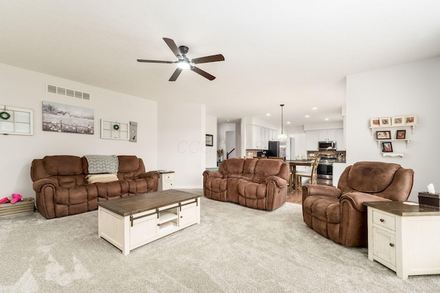 3012 Coltsbridge Dr, Lewis Center, OH 43035 - living area featuring light colored carpet, ceiling fan, and recessed lighting