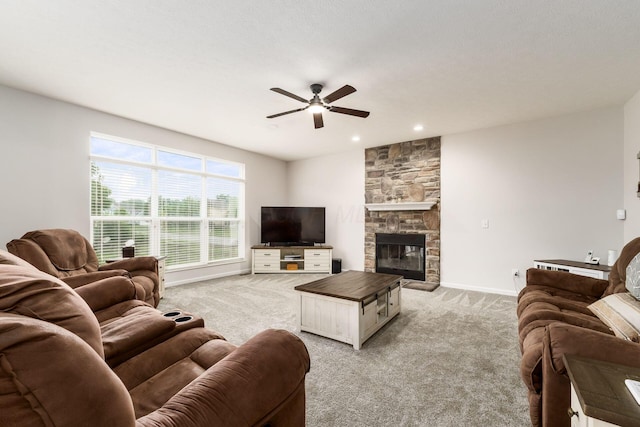 3012 Coltsbridge Dr, Lewis Center, OH 43035 - living area featuring ceiling fan, light carpet, a stone fireplace, and recessed lighting