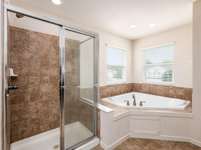 3012 Coltsbridge Dr, Lewis Center, OH 43035 - full bathroom featuring a shower stall, a bath, tile patterned floors, and recessed lighting