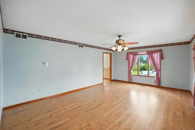 24 W High St, Jeffersonville, OH 43128 - empty room with ceiling fan, light wood-style floors, and crown molding