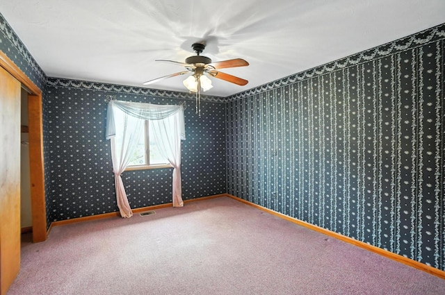 24 W High St, Jeffersonville, OH 43128 - carpeted empty room featuring a ceiling fan and wallpapered walls
