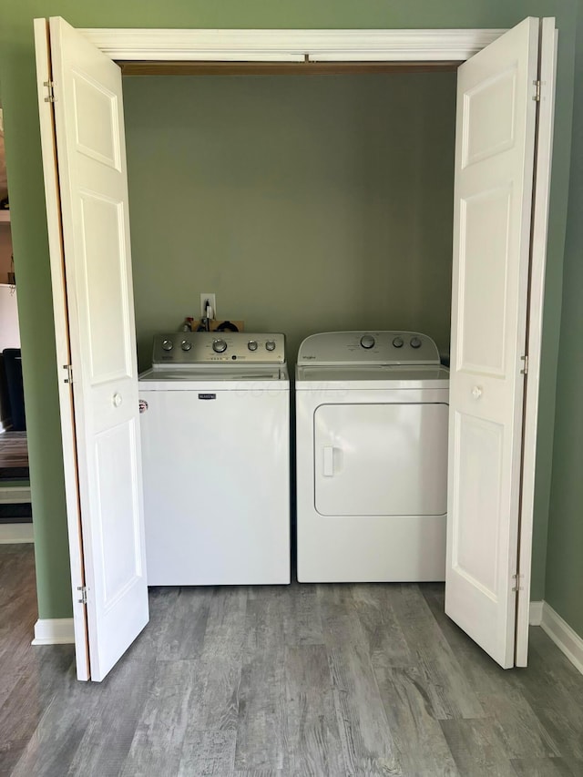 5356 Harding Hwy E, Caledonia, OH 43314 - laundry room featuring washer and clothes dryer and wood finished floors