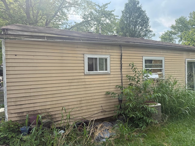 3032 Baker Hill Rd, Columbus, OH 43207 - view of property exterior featuring a cooling unit and a shingled roof