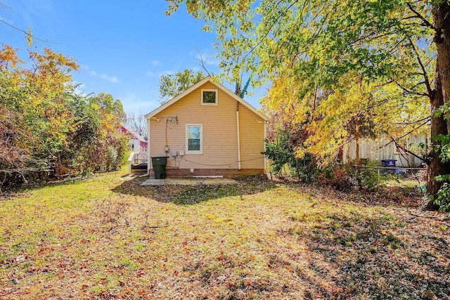 rear view of property featuring crawl space