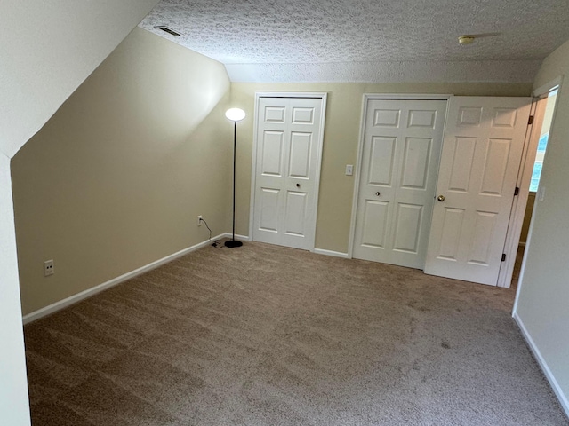 6282 Mcnaughten Place Ln Unit 39, Columbus, OH 43213 - additional living space with carpet and a textured ceiling