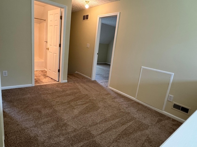 6282 Mcnaughten Place Ln Unit 39, Columbus, OH 43213 - unfurnished bedroom with carpet flooring, ensuite bathroom, and a textured ceiling