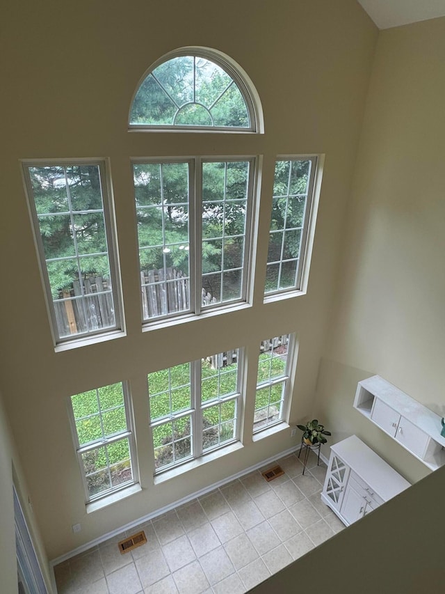 6282 Mcnaughten Place Ln Unit 39, Columbus, OH 43213 - interior space featuring tile patterned floors and a high ceiling