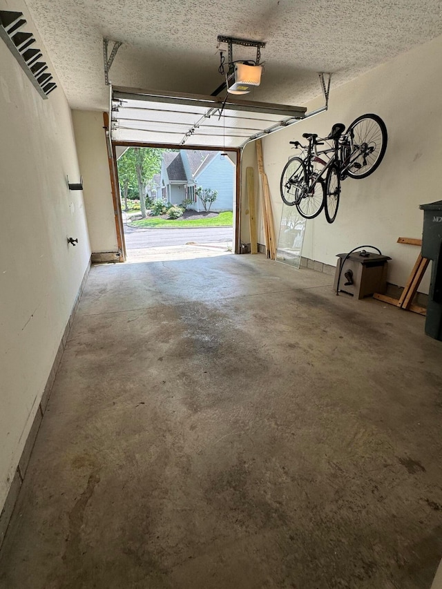 6282 Mcnaughten Place Ln Unit 39, Columbus, OH 43213 - garage featuring a garage door opener
