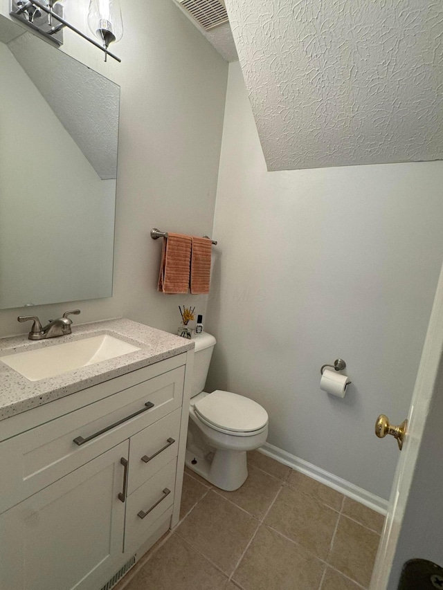 6282 Mcnaughten Place Ln Unit 39, Columbus, OH 43213 - bathroom with vanity, tile patterned floors, and a textured ceiling