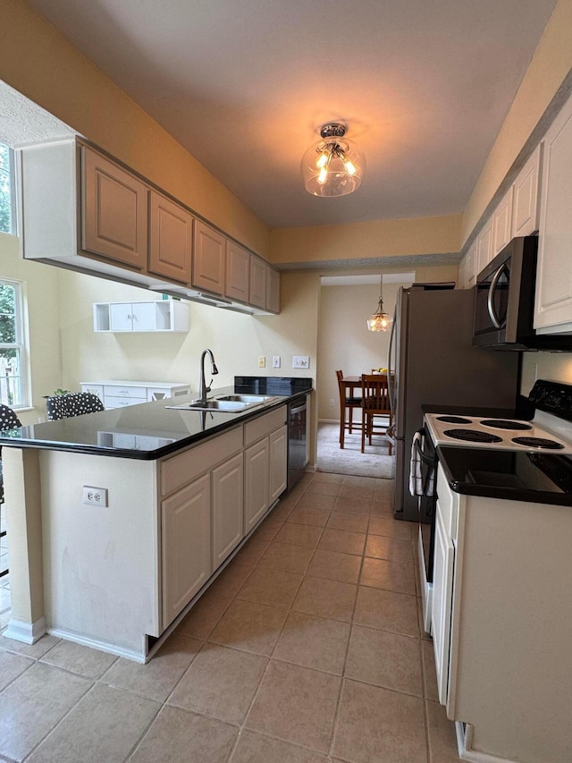 6282 Mcnaughten Place Ln Unit 39, Columbus, OH 43213 - kitchen featuring white range with electric stovetop, dark countertops, light tile patterned floors, dishwasher, and a chandelier