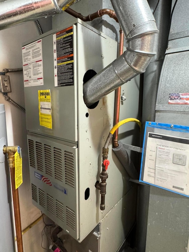 6282 Mcnaughten Place Ln Unit 39, Columbus, OH 43213 - utility room with heating unit