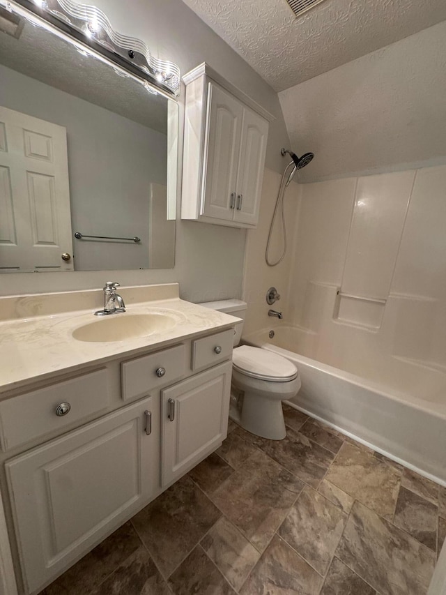 6282 Mcnaughten Place Ln Unit 39, Columbus, OH 43213 - full bath with a textured ceiling, vanity, shower / washtub combination, vaulted ceiling, and stone finish floors