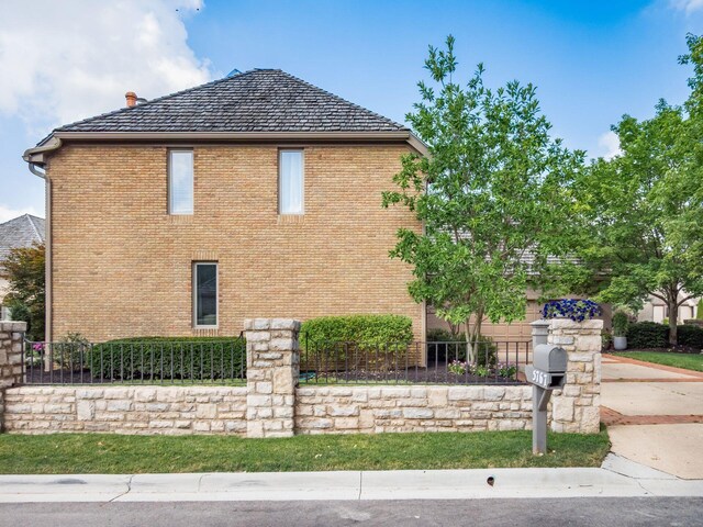 5767 Loch Maree Ct, Dublin, OH 43017 - view of home's exterior with brick siding and a chimney