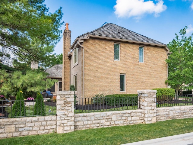 5767 Loch Maree Ct, Dublin, OH 43017 - view of home's exterior featuring a chimney and brick siding