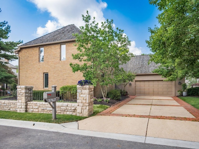 5767 Loch Maree Ct, Dublin, OH 43017 - view of front of property with brick siding, driveway, and an attached garage
