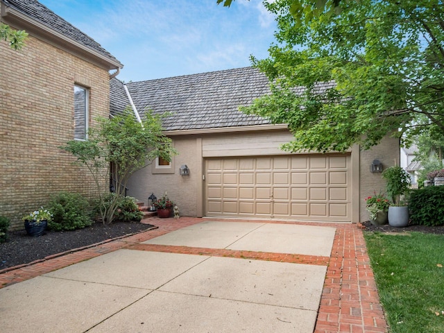 5767 Loch Maree Ct, Dublin, OH 43017 - view of front of property featuring driveway, an attached garage, and brick siding