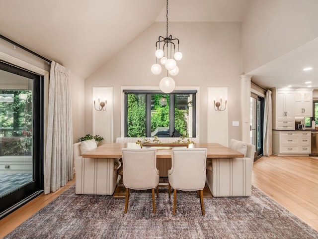 5767 Loch Maree Ct, Dublin, OH 43017 - dining space featuring high vaulted ceiling, light wood-style floors, and a chandelier