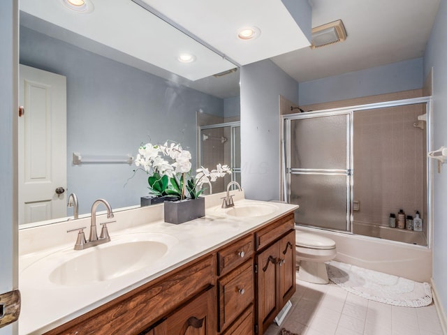 5767 Loch Maree Ct, Dublin, OH 43017 - full bathroom featuring double vanity, tile patterned flooring, combined bath / shower with glass door, and recessed lighting