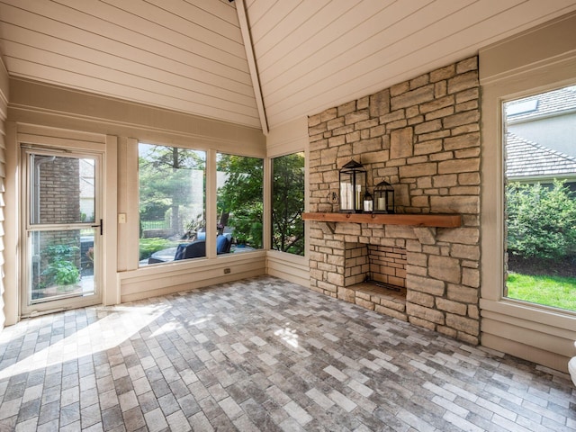 5767 Loch Maree Ct, Dublin, OH 43017 - unfurnished sunroom featuring brick patterned flooring, healthy amount of natural light, and lofted ceiling