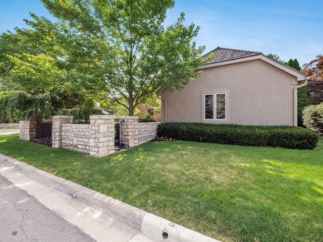 5767 Loch Maree Ct, Dublin, OH 43017 - view of side of home with a yard and brick siding