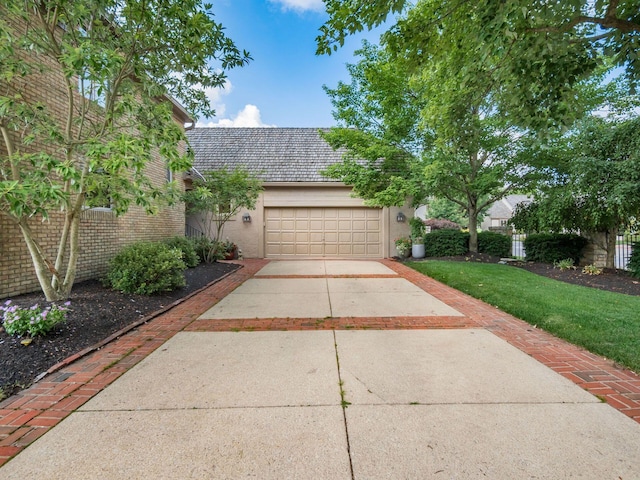 5767 Loch Maree Ct, Dublin, OH 43017 - view of front of property with concrete driveway, an attached garage, and a front lawn