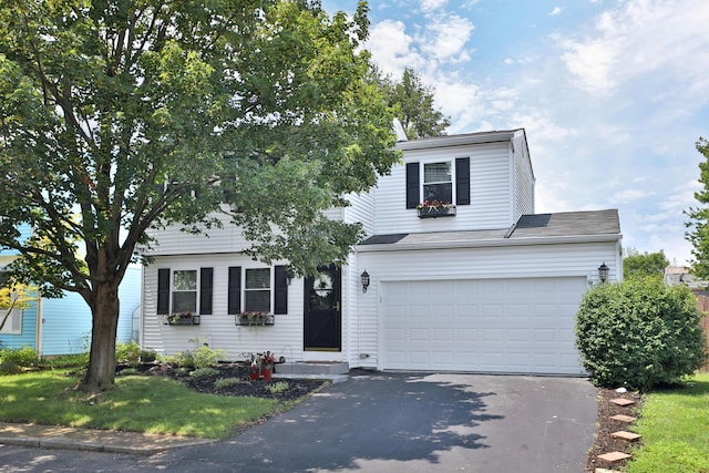 7617 Whitneyway Dr Unit 120, Columbus, OH 43085 - traditional-style house featuring driveway and an attached garage