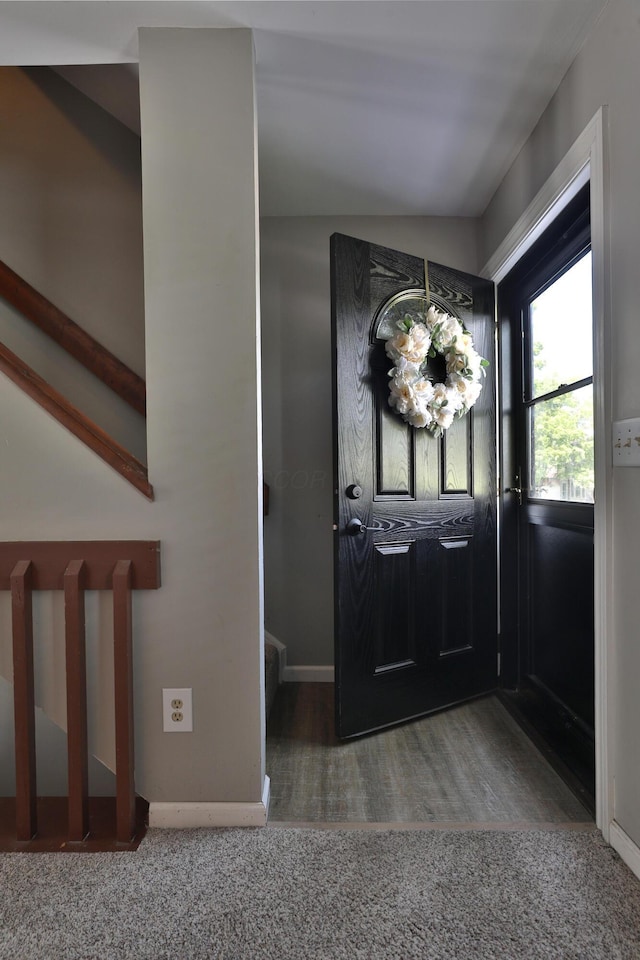 7617 Whitneyway Dr Unit 120, Columbus, OH 43085 - carpeted foyer entrance featuring vaulted ceiling and wood finished floors