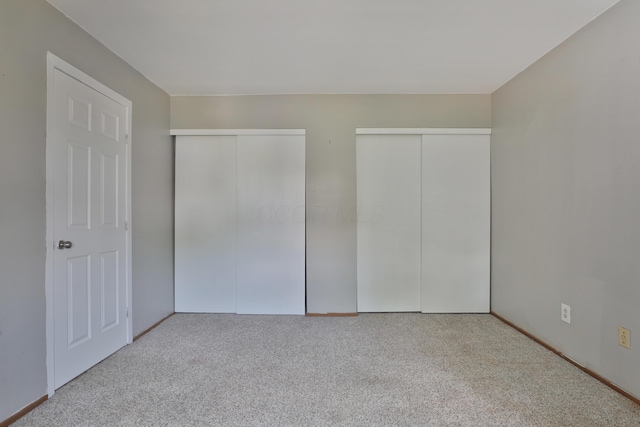 7617 Whitneyway Dr Unit 120, Columbus, OH 43085 - unfurnished bedroom with multiple closets and carpet flooring