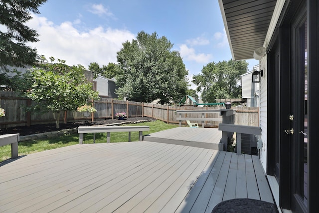 7617 Whitneyway Dr Unit 120, Columbus, OH 43085 - wooden deck featuring a fenced backyard and a playground